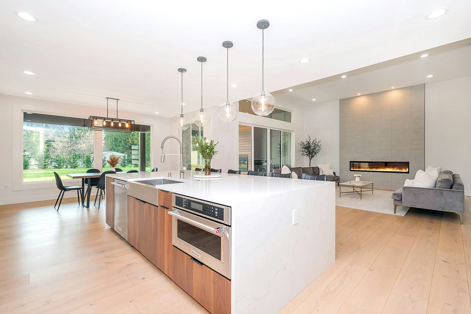 Custom Bay Area kitchen with a large island, open to the living space, in a modern remodel