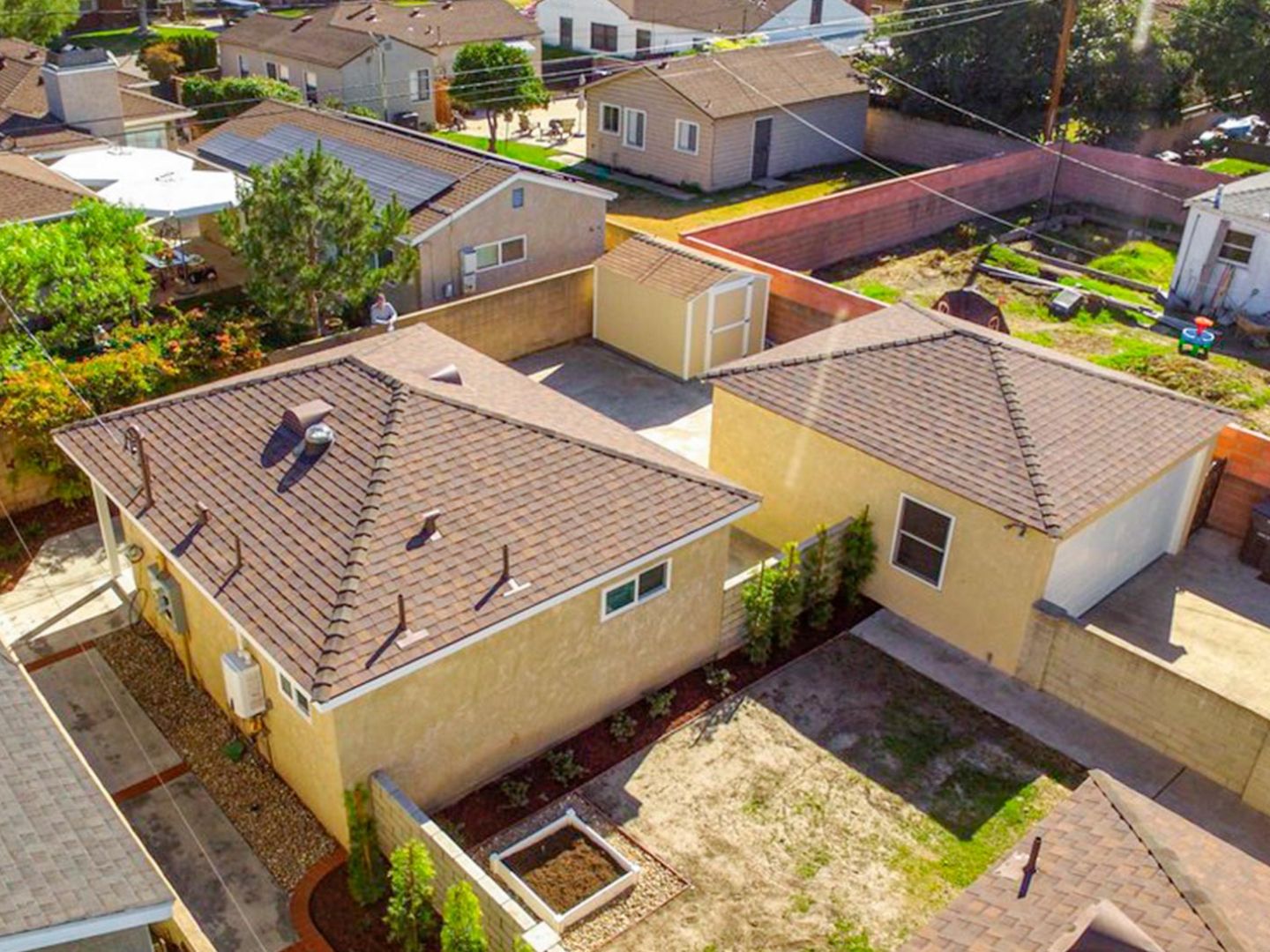 aerial view of a Bay Area property with a detached ADU correctly sited within setback and easement constraints